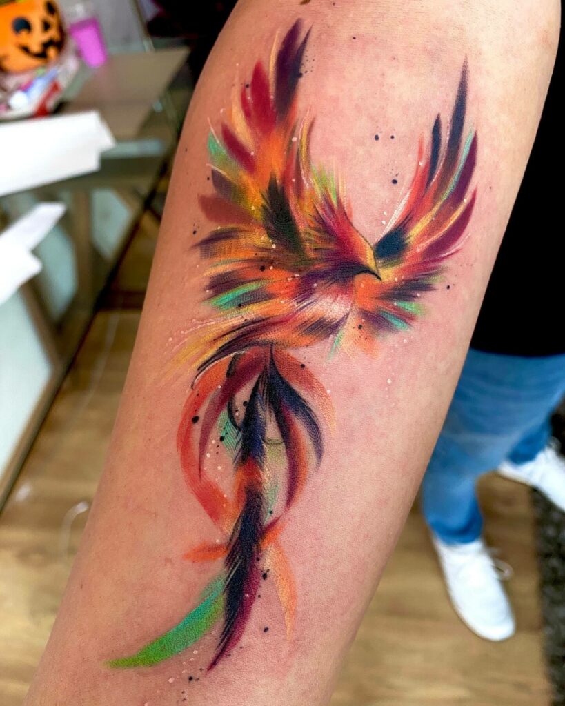 11+ Bird Forearm Tattoo Ideas That Will Blow Your Mind! 14 Prismatic Phoenix Bird Tattoo