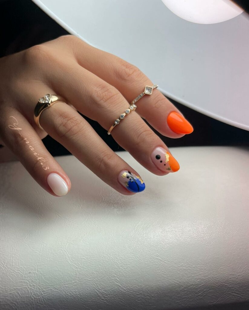 20 Latest Orange And Blue Nail Ideas To Try In 2024! 23 Orange And Blue Nails With Gold Flakes