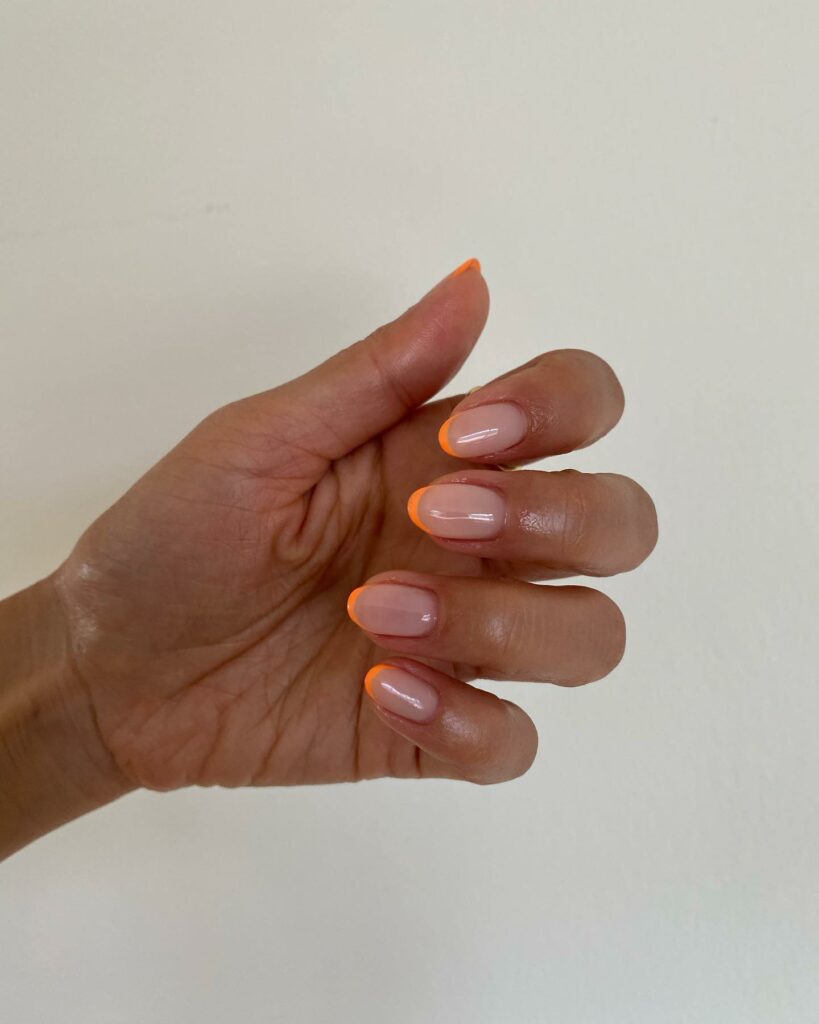 20 Latest Thin French Tip Nail Designs To Try In 2024! 14 Thin Orange French Tip Almond Nails