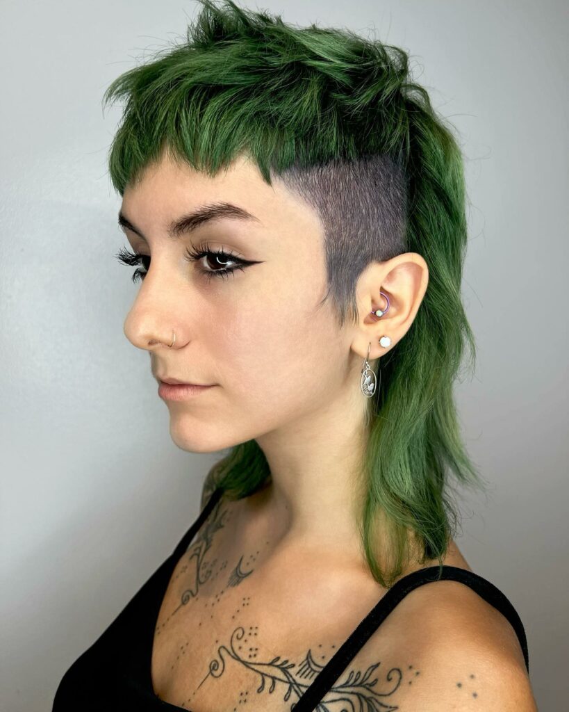 35 Short-Sided Shaved Female Hairstyles to Flaunt Your Boldness in 2024 38 Green Pixie with Gradual Shave