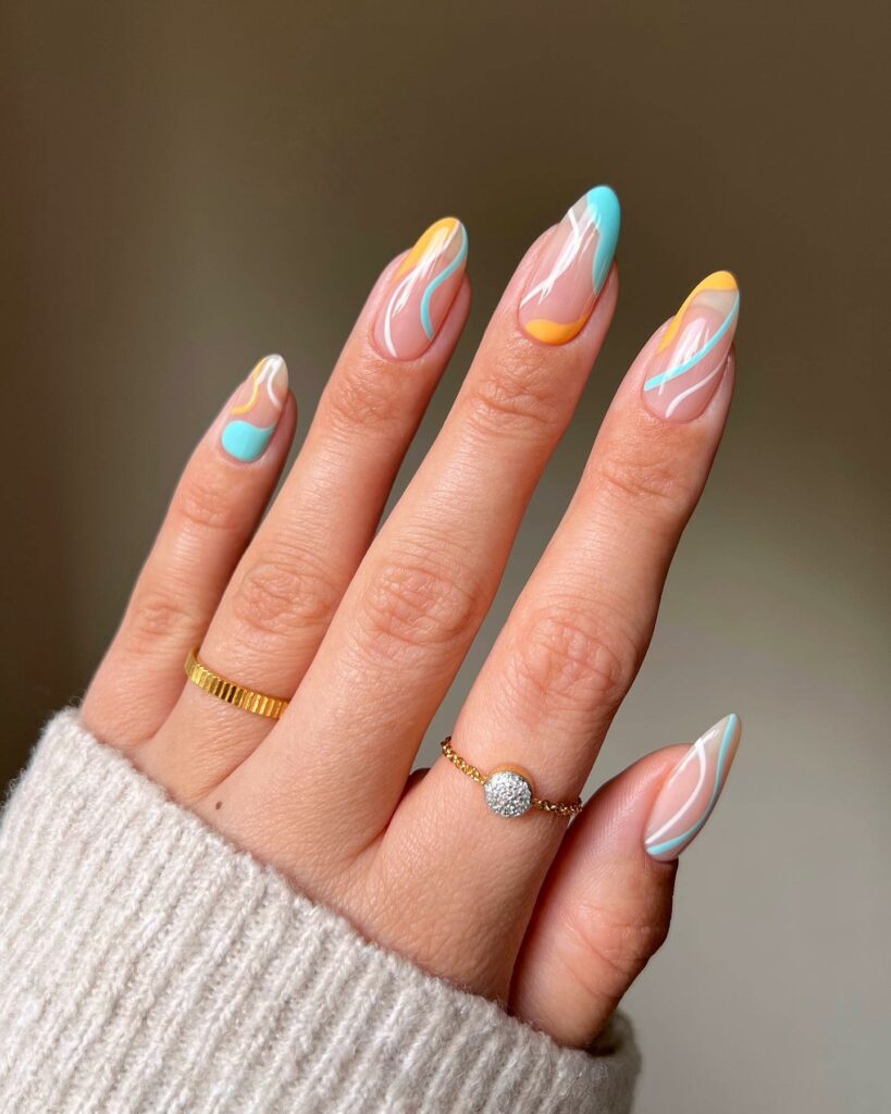 20 Latest Orange And Blue Nail Ideas To Try In 2024! 12 Orange And Blue Abstract Almond Nails With Swirl