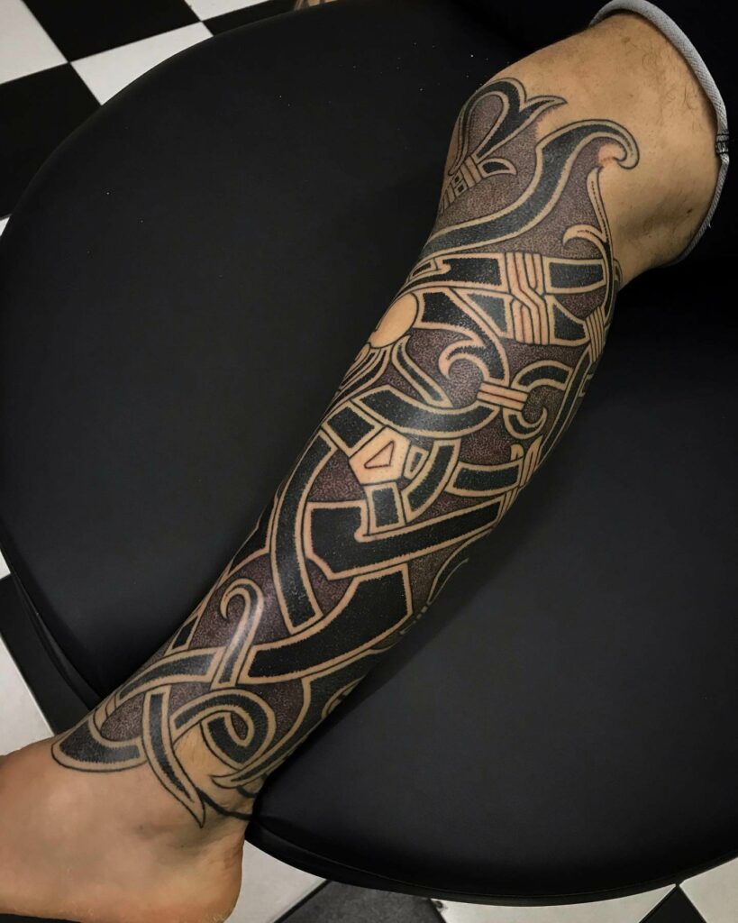 11+ Wild Tribe Tattoo Ideas That Will Blow Your Mind! 19 Odin Godmask Lower Leg Wild Tribe Tattoos