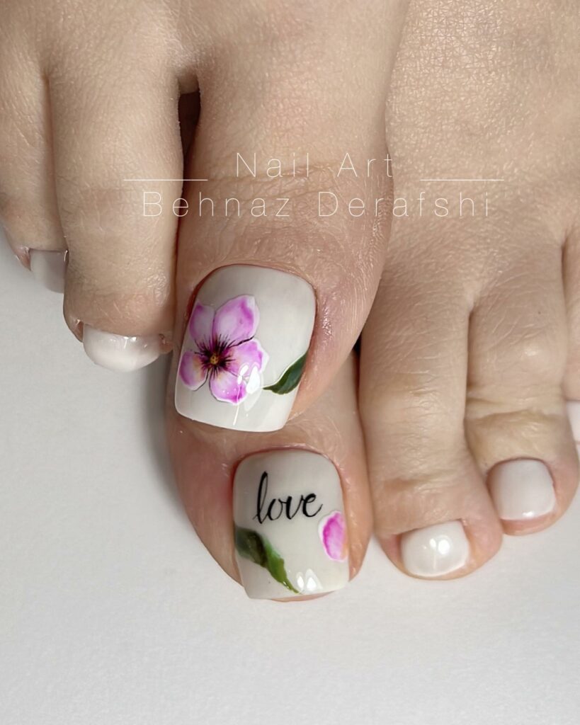 20 Latest Flower Pedicure Designs To Try In 2024! 16 White Pedicure With 'Love' And Cherry Blossom Design
