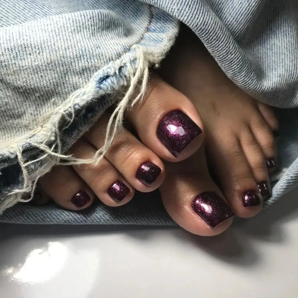 15 Latest Dark Purple Pedicure Designs To Try In 2024! 14 Dark Purple Pedicure With Glitter