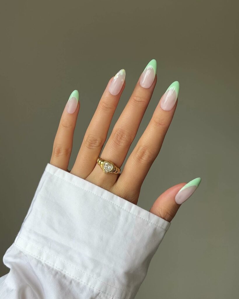 25 Latest Accent Nail Designs To Try In 2024! 12 French Light Green Accent Nails With Flowers Design