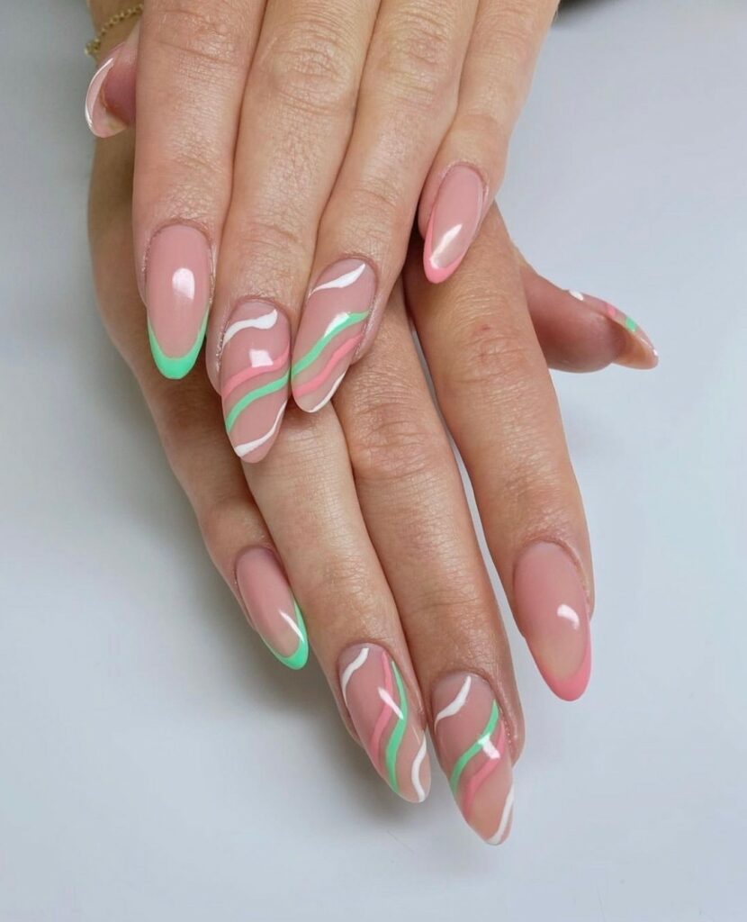 20 Latest Negative Space Nail Ideas To Try In 2024! 19 Negative Space Nails With Green And Pink Swirl