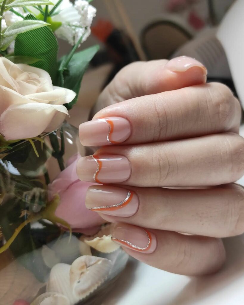 Attend in Style with 25 Wedding Guest Nail Designs in 2024 20 Pink Wedding Guest Nails With Gold And Orange Swirls