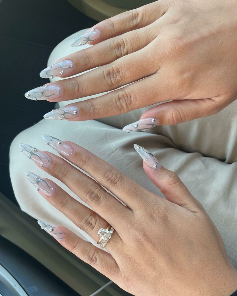 Glow with 20 Pearl White Nail Designs in 2024 24 White Pearl Nails With Silver Tribal Design
