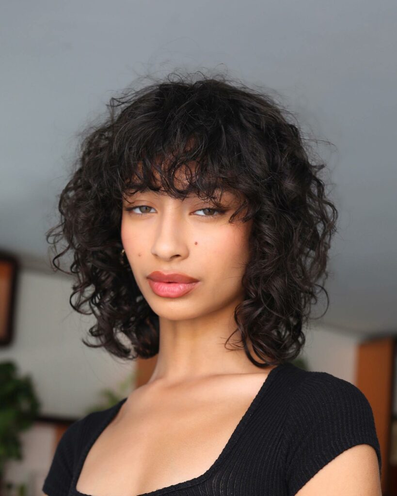 25 Short Layered Haircut Ideas to Revamp Your Look in 2024 13 Curly Cut with Bangs