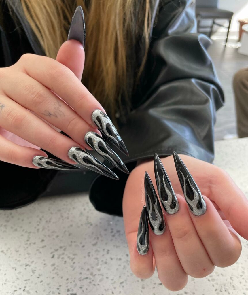 40 Latest Black Stiletto Nail Ideas To Try In 2024! 27 Long Black Stiletto Flame Nails with Glitter