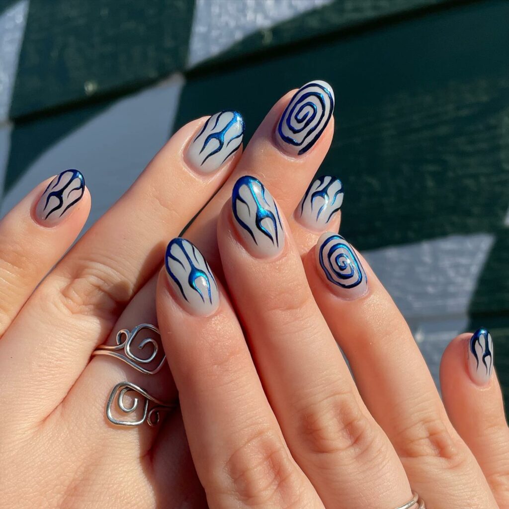 20 Latest Short Blue Nail Designs To Try In 2024! 39 Metallic Blue Short Nails With Flame And Spiral Design
