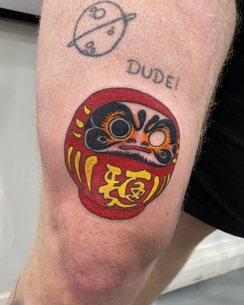 AMAZING DARUMA DOLL TATTOOS DESIGNS & MEANINGS - UPDATED FOR 2024 11 Daruma Doll Tattoo One Eye Tattoo