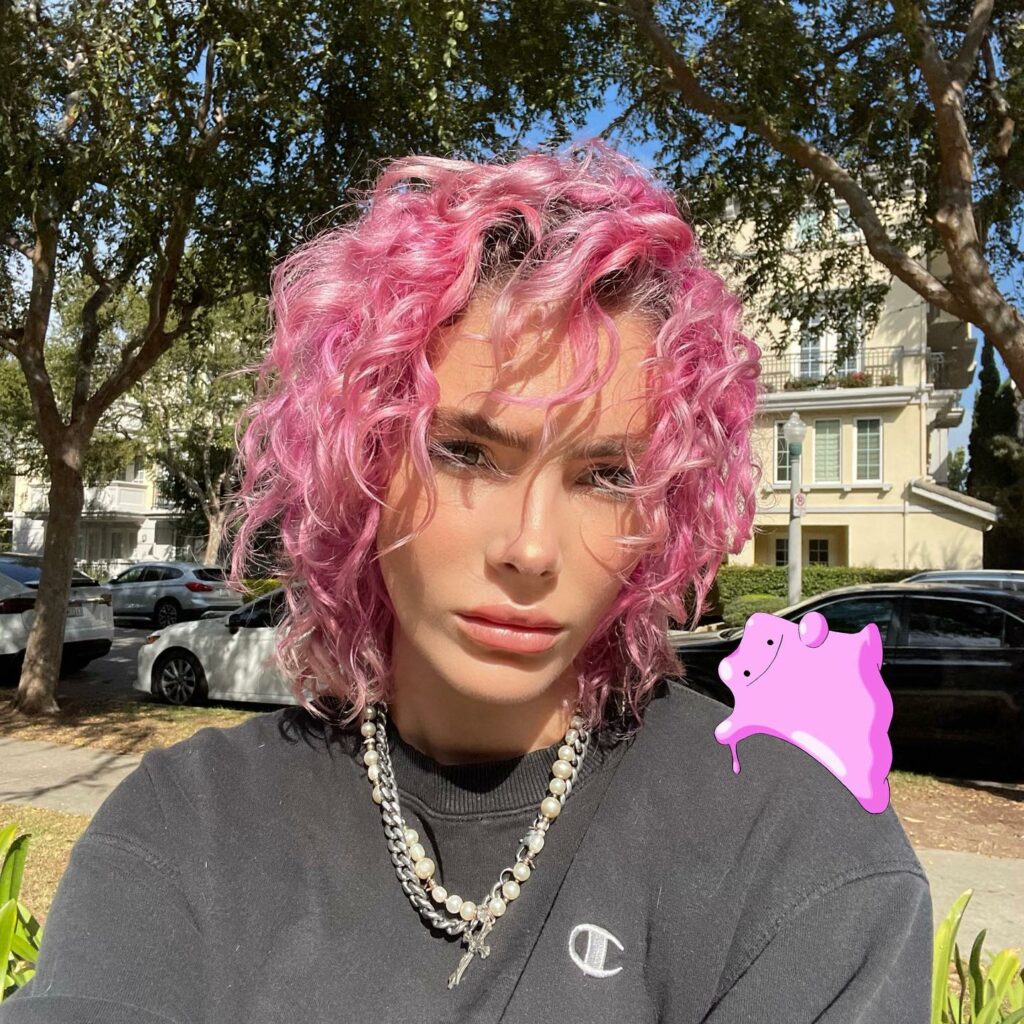 45 Pink Hairstyles to Add a Pop of Color to Your Look in 2024 31 Pink Curly Hair