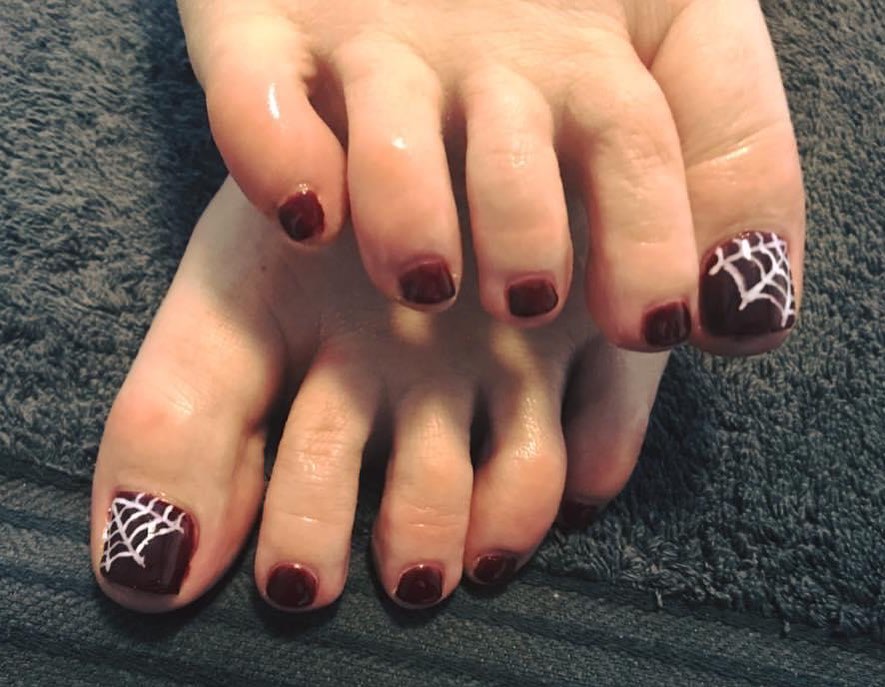 30 Spooky Halloween Pedicure Ideas to Try in 2024 17 A Web of Surprises