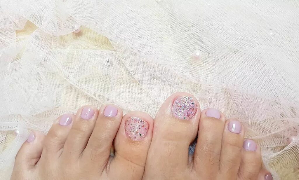 23 Elegant Pedicure Designs to Try in 2024 21 Playful Pink with Glittery Vibes