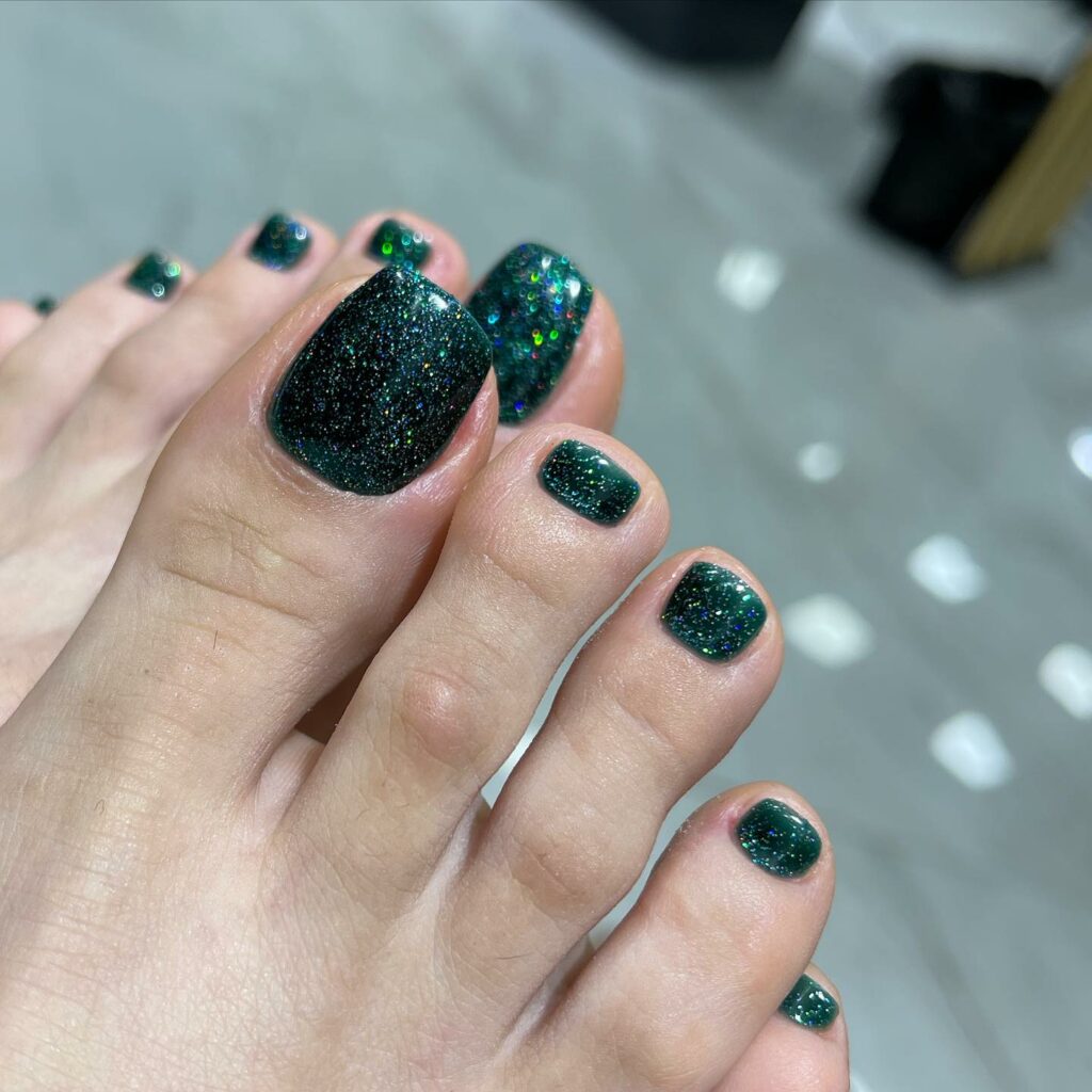 40 Latest Dark Green Pedicure Ideas To Try In 2024! 17 Glitter Glow Dark Green Pedicure
