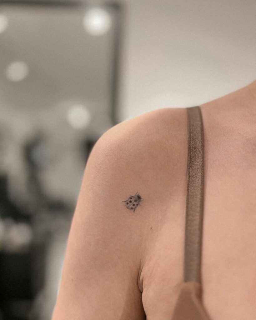 BEAUTIFUL SHOULDER TATTOO IDEAS FOR WOMEN IN 2024 13 Ladybug Small Front Shoulder Tattoo