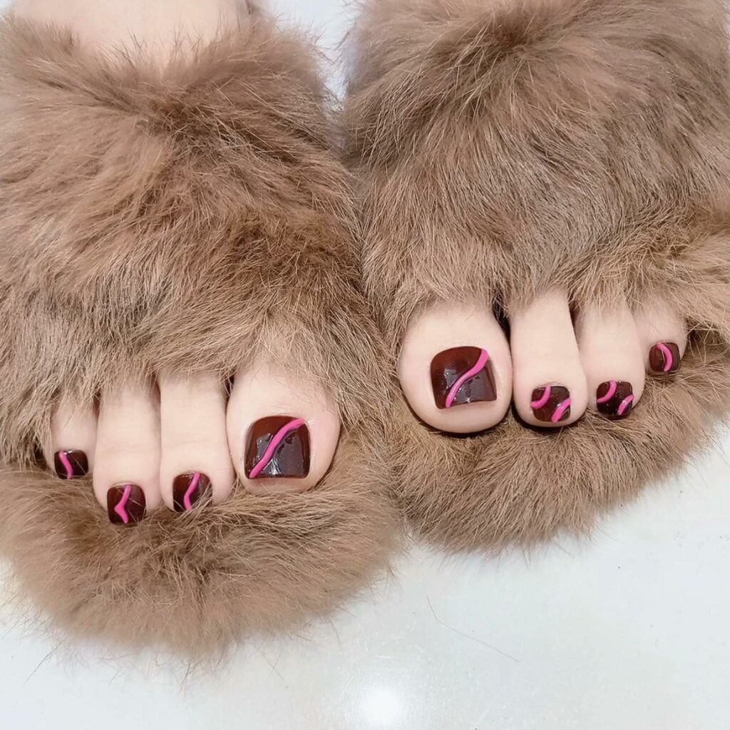 20 Latest Brown Pedicure Designs To Try In 2024! 21 Brown Pedicure With Pink Swirl Design