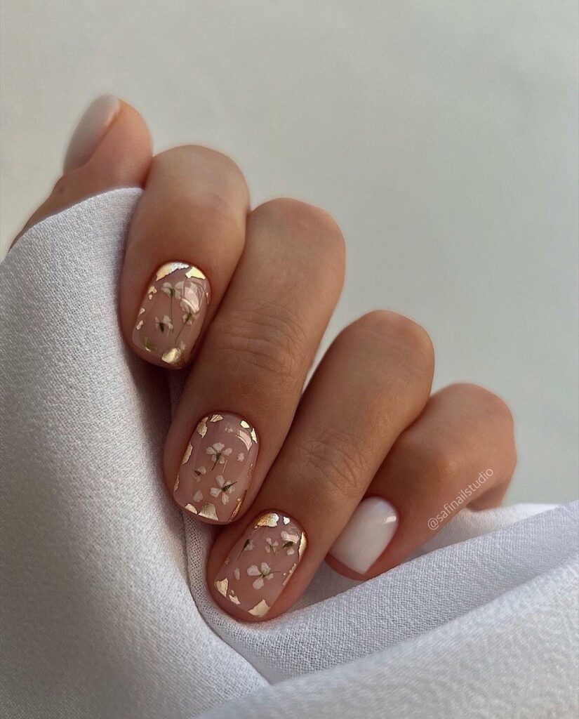 Attend in Style with 25 Wedding Guest Nail Designs in 2024 13 Clear Wedding Guest Nail With Daisy Flower And Gold Flakes