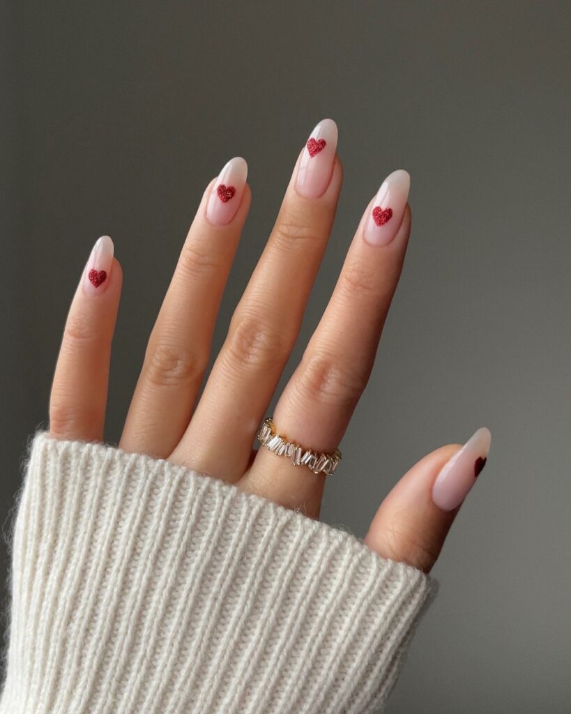 20 Latest Minimalist Nail Ideas To Try In 2024! 12 Minimalist Almond Nails With Red Heart Design