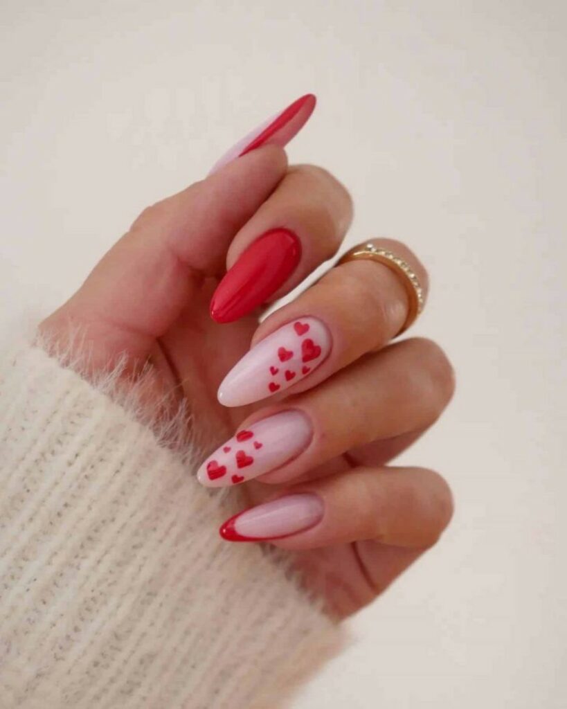 27 Romantic Nail Designs to Try for Valentine's Day 2024! 10 Artistic Love Affair: Oval Light Pink Nails with Red Hearts