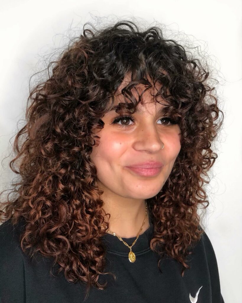 25 Curly Hair Perm Ideas to Transform Your Look in 2024 23 Spiral Perm Hairstyle with Bangs