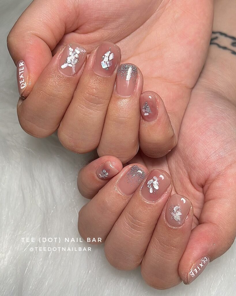 20 Latest February Nail Designs To Try In 2024! 29 Short Nude February Nails With Silver Foils And Glitter