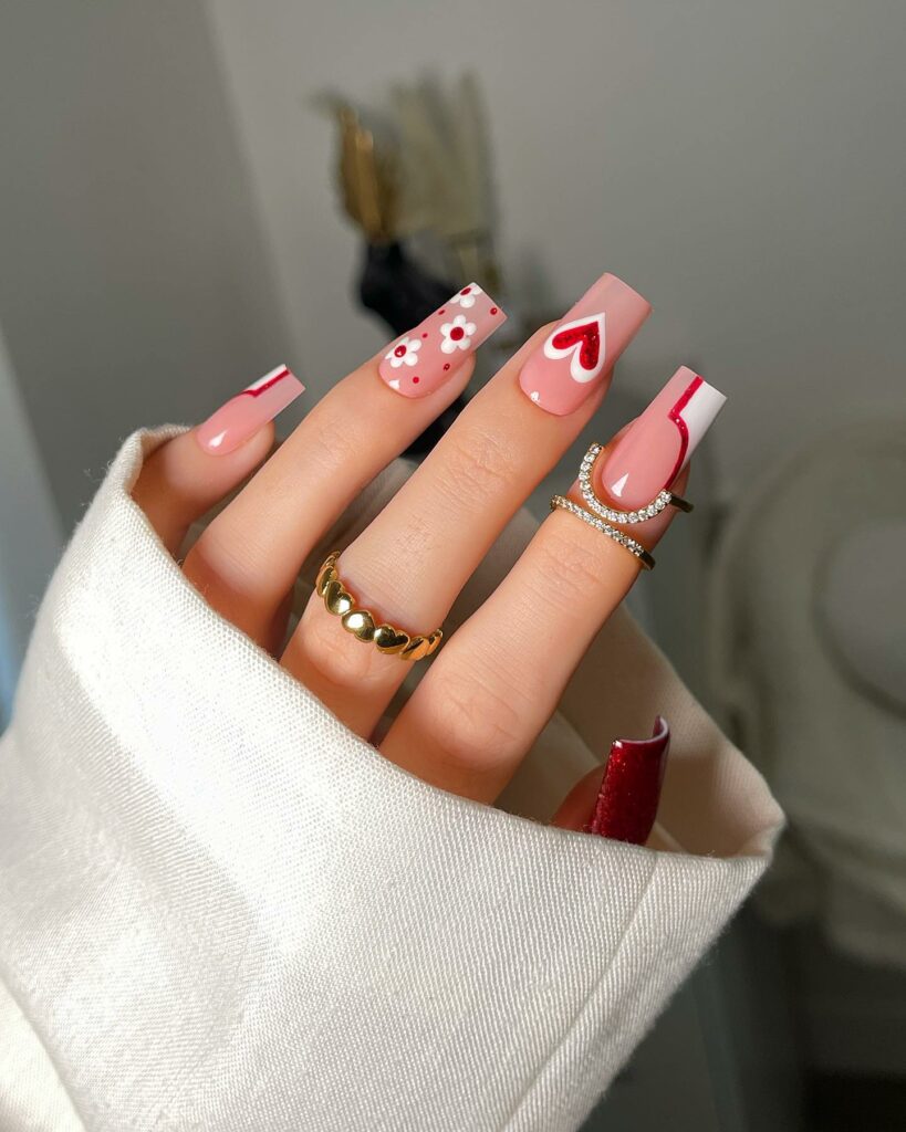 27 Romantic Nail Designs to Try for Valentine's Day 2024! 17 Passionate Petals: Red Hearts & Flowers on Square Nails
