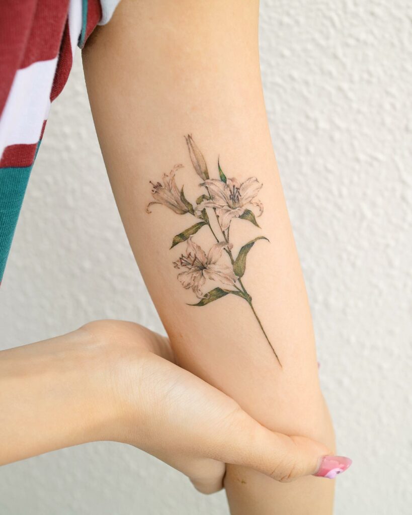 FLORAL TATTOO MEANINGS & 10 AMAZING DESIGNS TO INSPIRE YOU! 17 Lily Flower Tattoo