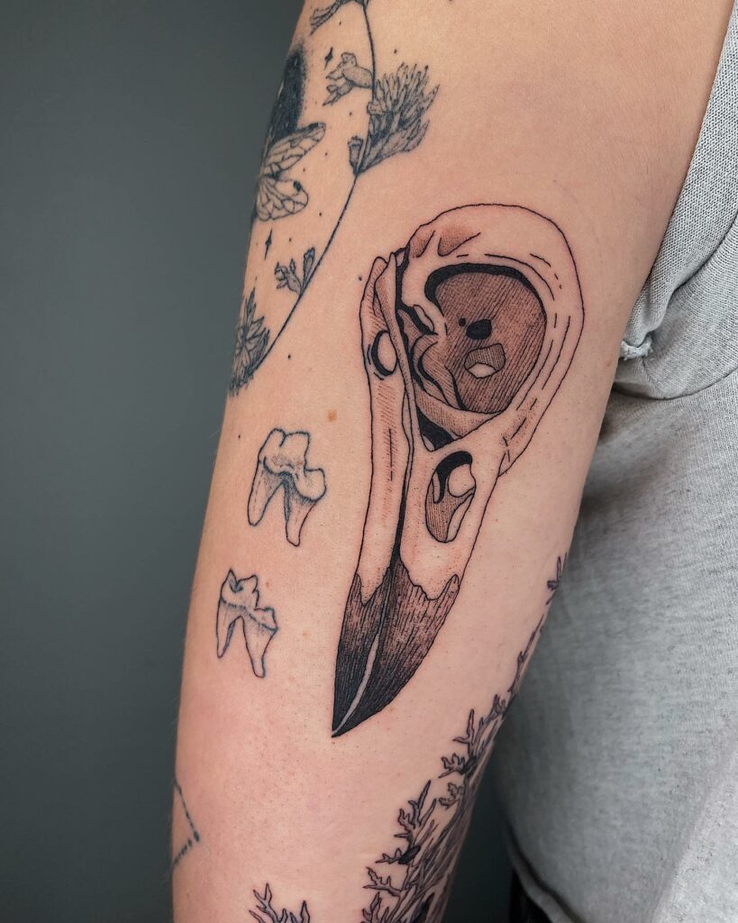 AMAZING ANIMAL SKULL TATTOO IDEAS AND THEIR MEANINGS IN 2024 32 Raven Skull Tattoos
