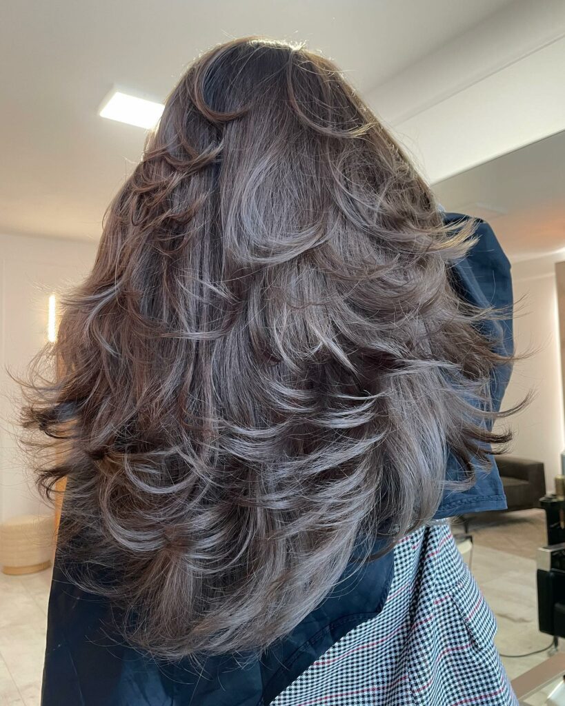 25 Butterfly Haircut Ideas to Elevate Your Style in 2024 31 Bronze-Tinted Chunky Layers