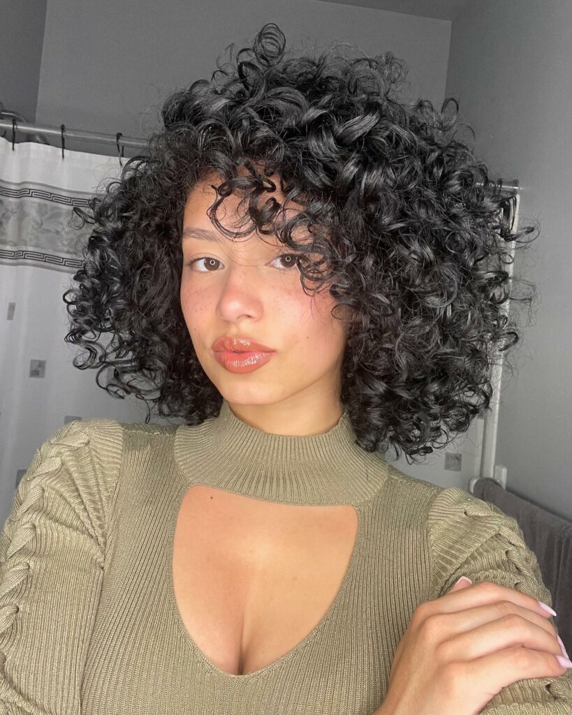 25 Short Layered Haircut Ideas to Revamp Your Look in 2024 19 Side-Parted Curly Bob