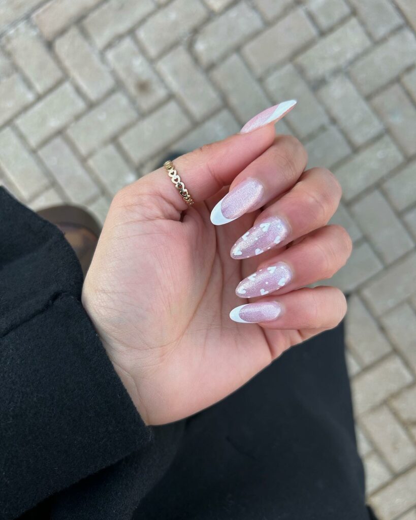 20 Latest February Nail Designs To Try In 2024! 14 White French February Nails With Hearts And Glitter