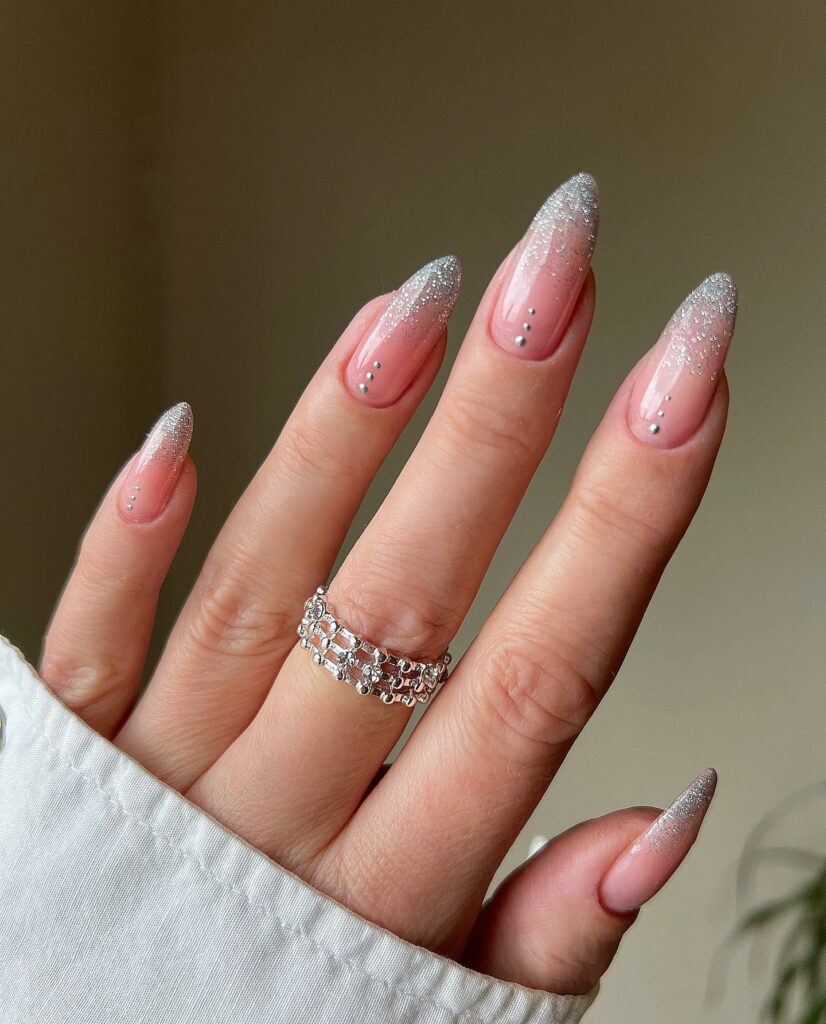 Celebrate with 40 Christmas Statement Nail Designs in 2024 23 Silver Glitter French Christmas Statement Nails