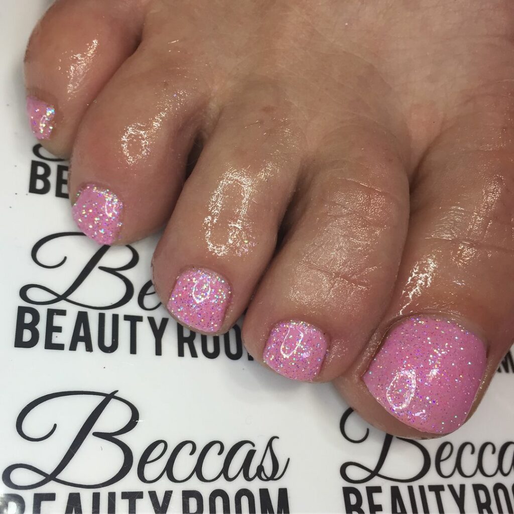 23 Elegant Pedicure Designs to Try in 2024 13 Pink Glitter Toe Nails
