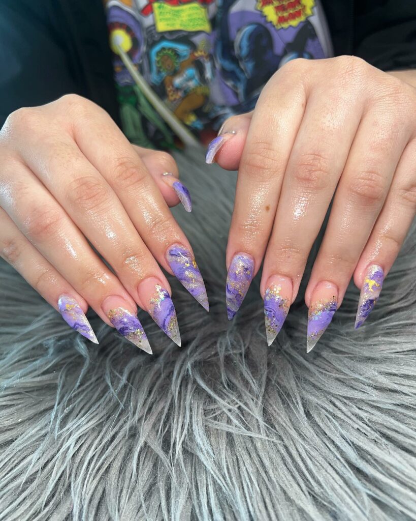 20 Latest Purple And Gold Nail Ideas To Try In 2024! 26 Purple Marble Stiletto Nails With Gold Flakes