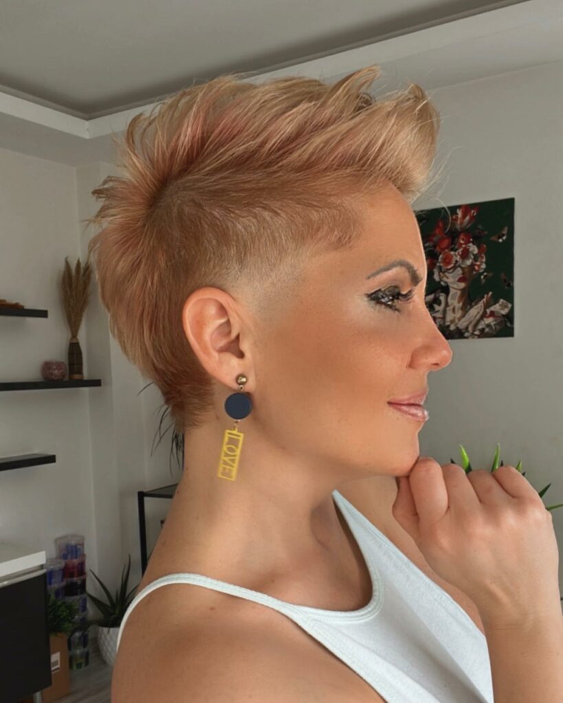 35 Short-Sided Shaved Female Hairstyles to Flaunt Your Boldness in 2024 19 Platinum Blonde Faux Hawk