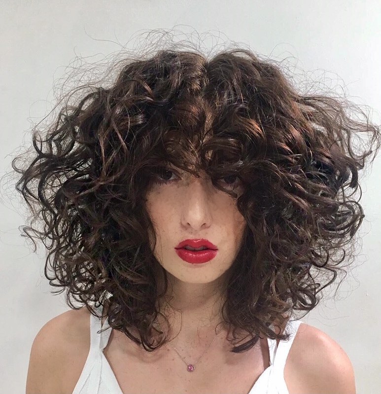 30 Curly Hairstyles Ideas to Flaunt Your Curls in 2024 35 Voluminous Wavy Cut with Side Bangs