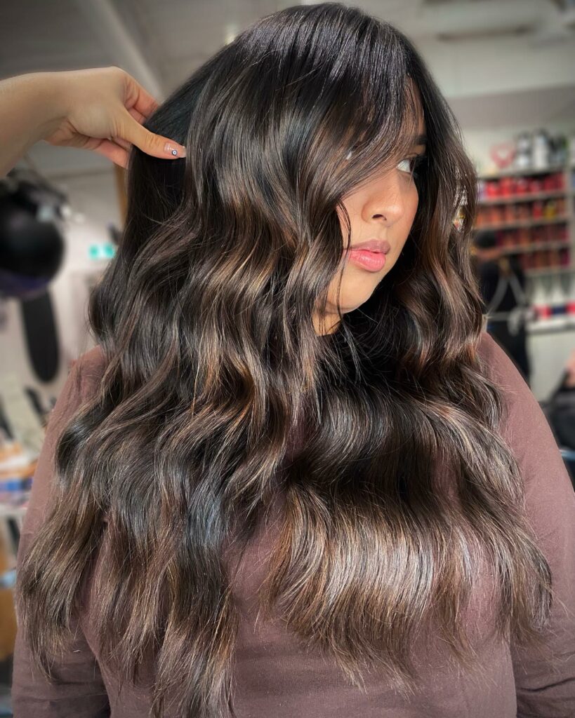 25 Butterfly Haircut Ideas to Elevate Your Style in 2024 33 Rock the Smokey Brown with Intense Layers
