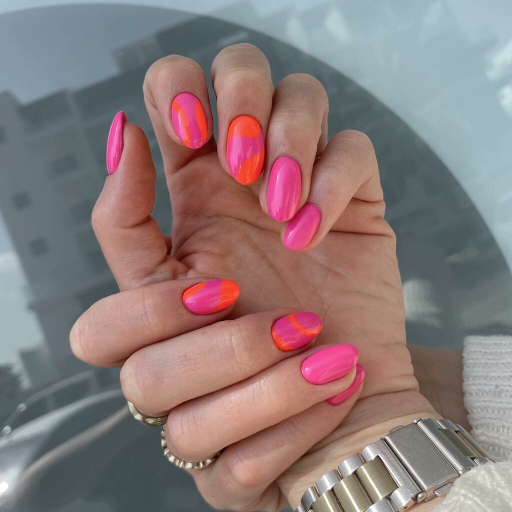 22 Latest Short Pink Nail Ideas To Try In 2024! 24 Almond Short Pink Nails with Orange Swirl Designs