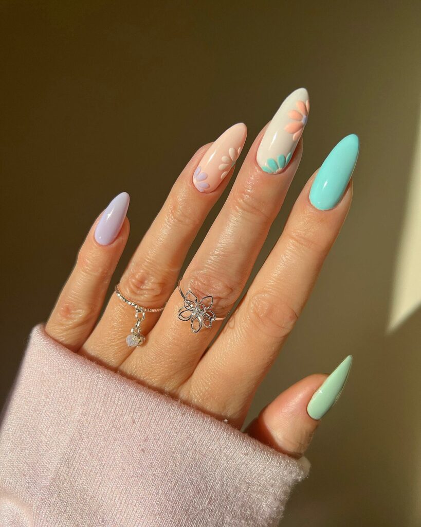 20 Latest Tiffany Blue Nail Ideas To Try In 2024! 16 Tiffany Blue And Purple Almond Nails With Colorful Flower Design