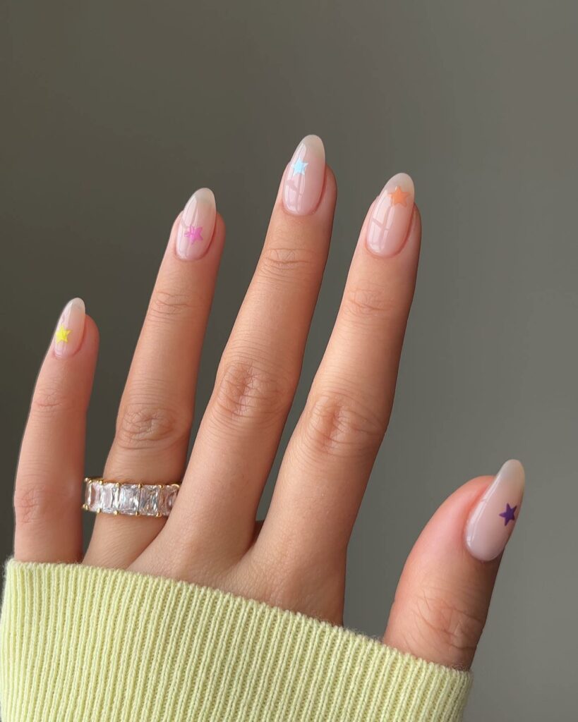 20 Latest Minimalist Nail Ideas To Try In 2024! 26 Gel Almond Nails With Colorful Star Design
