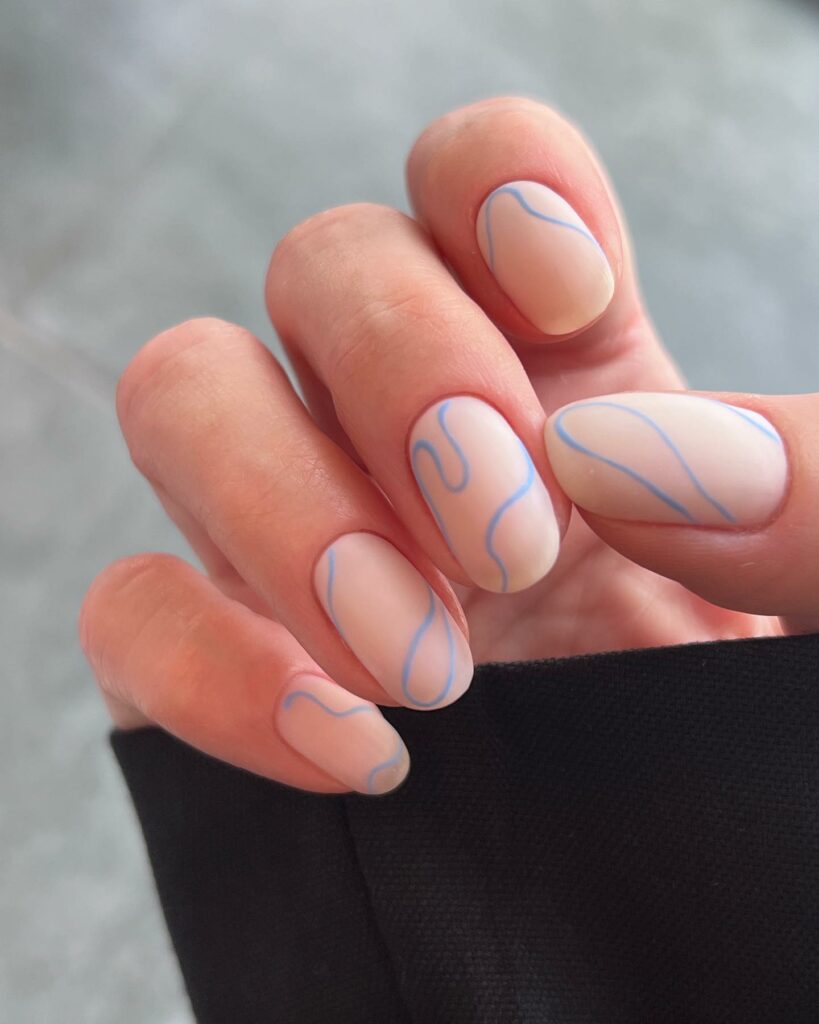 40 Latest Short Summer Nail Designs To Try In 2024! 21 Minimalist Round Nails With Thin Blue Swirl Design