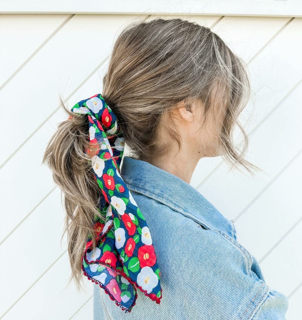 35 Ponytail Hairstyles Ideas for Effortless Elegance in 2024 34 Low Ponytail With a Bandana Hair Tie
