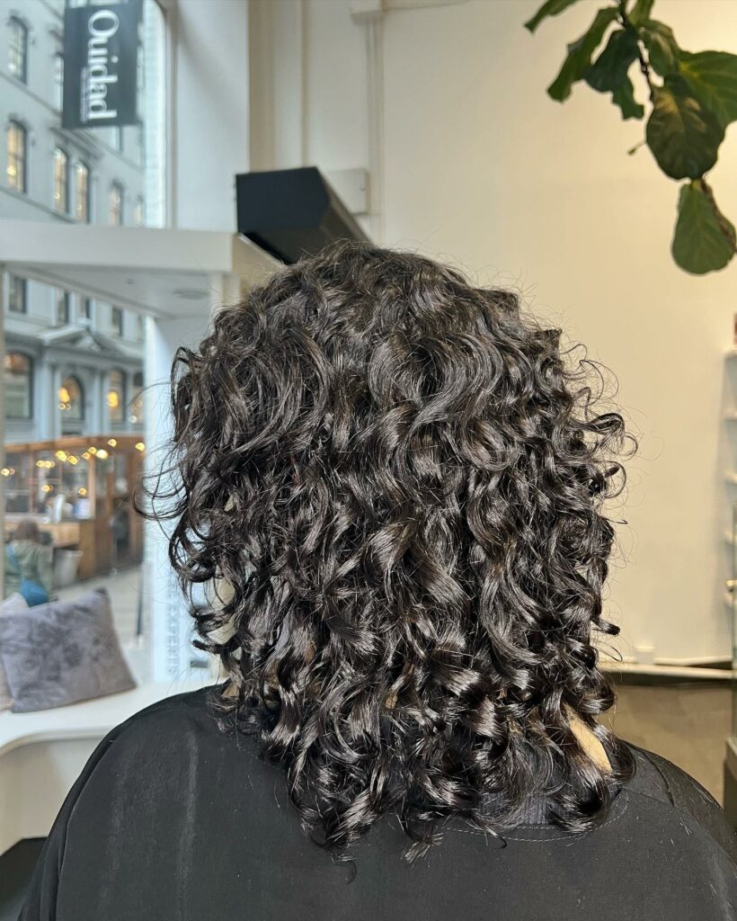 25 Curly Hair Perm Ideas to Transform Your Look in 2024 14 Spirals on Spirals