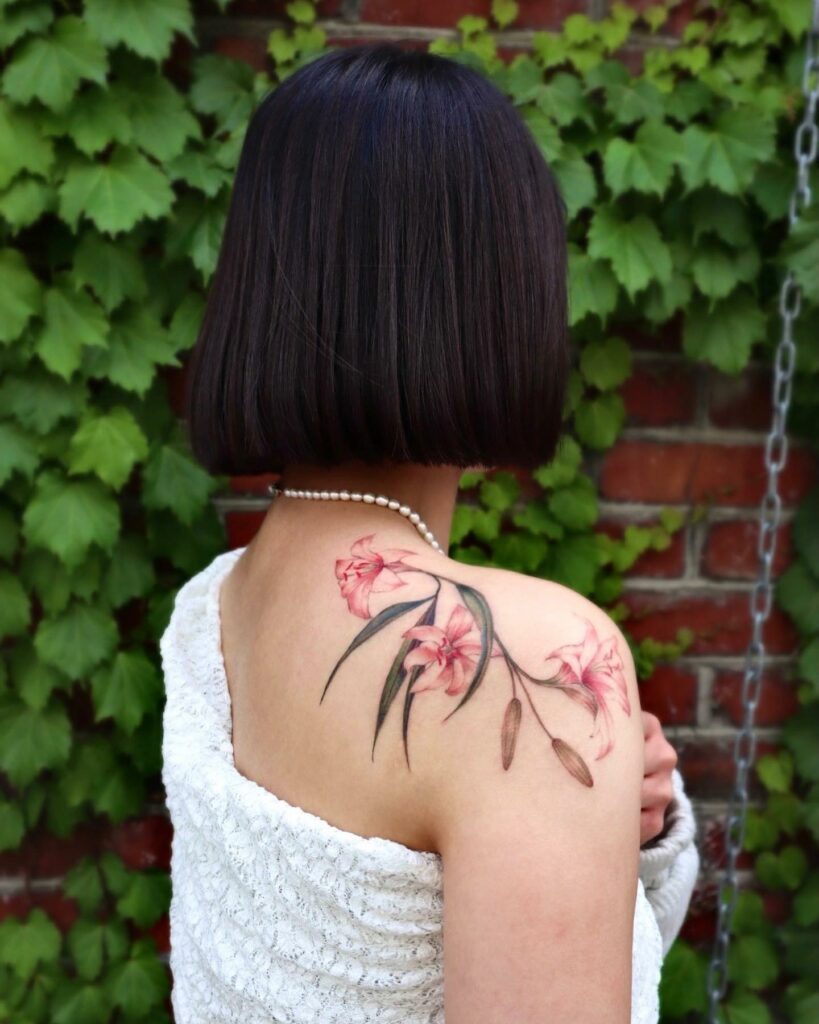 AMAZING LILY TATTOO DESIGNS + A DEEP DIVE INTO THEIR MEANINGS IN 2024 14 Pink Lily Tattoo