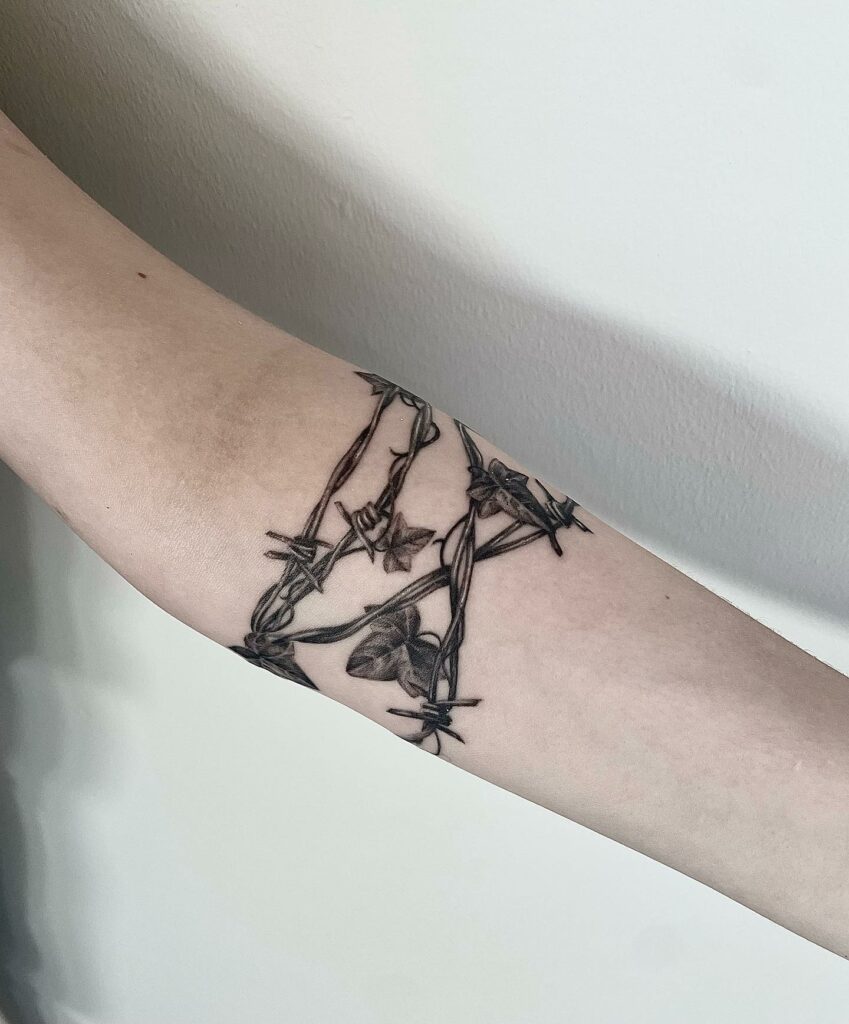 12 Amazing Barbed Wire Tattoos & Their Meanings 18 Barbed wire arm tattoo