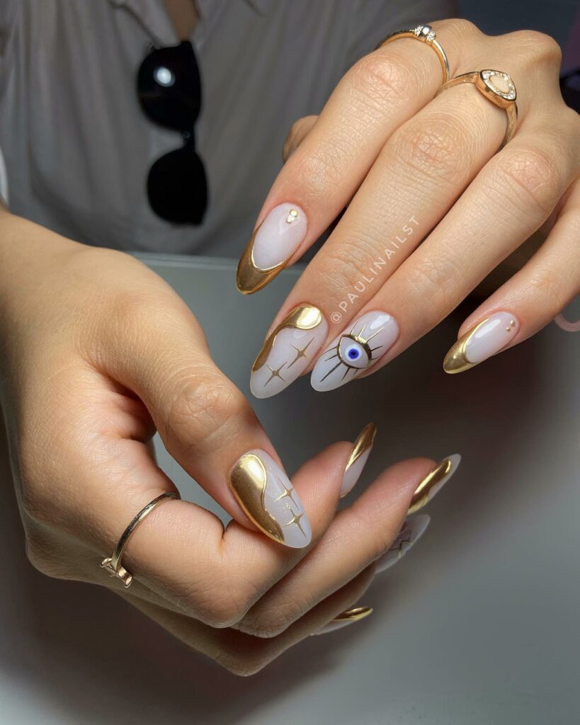 55 Latest Gold French Tip Nail Ideas To Try In 2024! 23 Abstract Gold French Nails With Evil Eye