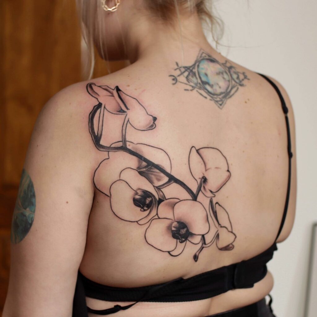 BEAUTIFUL SHOULDER TATTOO IDEAS FOR WOMEN IN 2024 19 Back Orchid Design Shoulder Tattoo