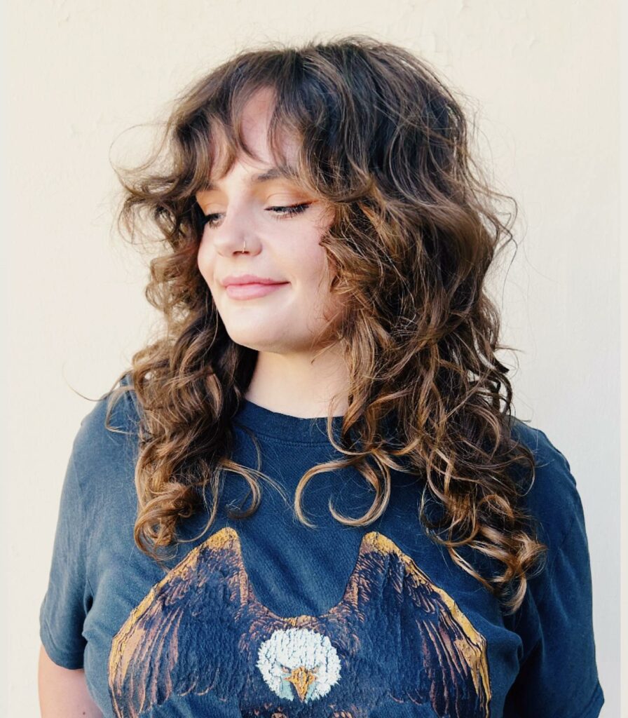 30 Curly Hairstyles Ideas to Flaunt Your Curls in 2024 26 Wavy Pin-Up Bangs